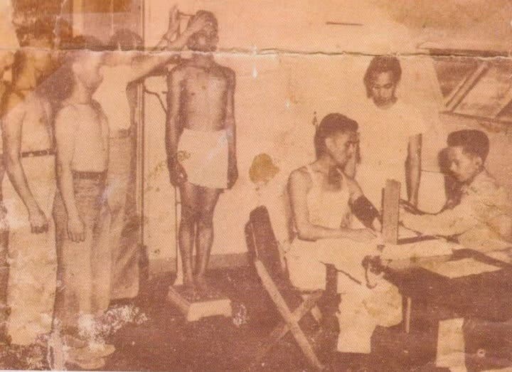 Applicants whose height are being measured. A recruit must be atleast 5_6 in height to qualify in Marine Alpha Company