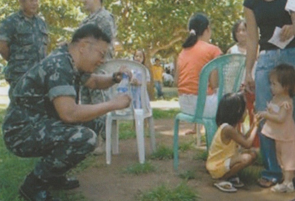 LTCOL Bayong interacts with children during a MEDCAP