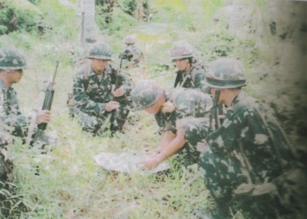 A Marine squad orienting their map during on of the combat operations against the MILF