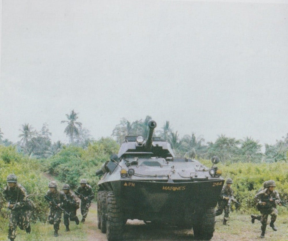 Members of the PMC conduct a tank infantry ops to clear the Narciso-Ramos Highway