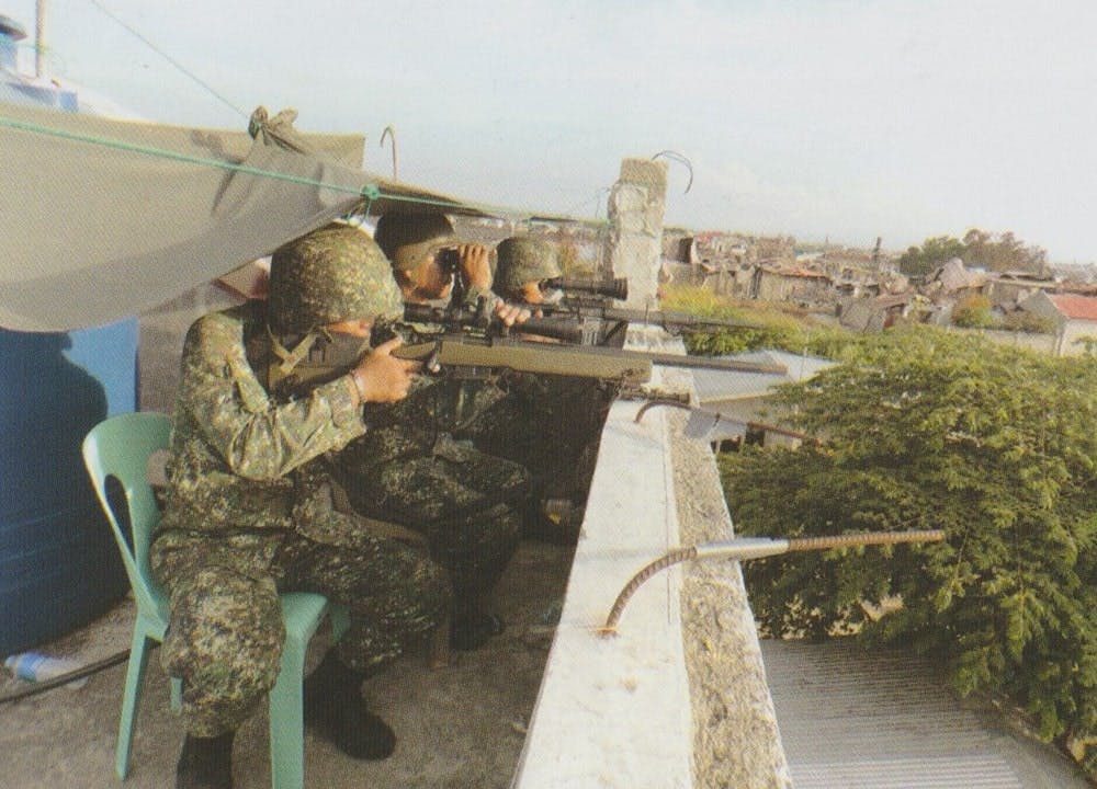Snipers scrutinizing the area to assure that the enemy has nowhere to go