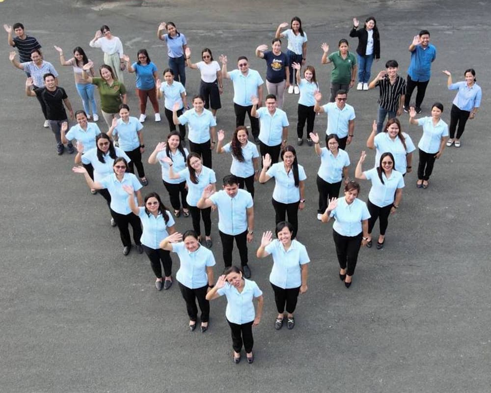 Civilian workforce posing on the staircase